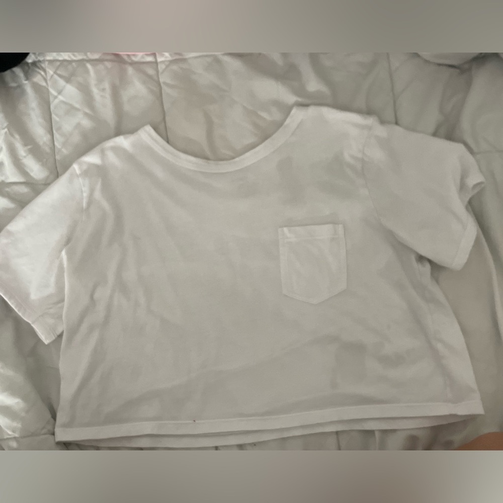 white and black short sleeve cropt top with left upper pocket. size mediums